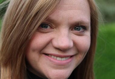 Reverend Kate Bottley, a Church of England vicar, smiles while wearing a clerical collar