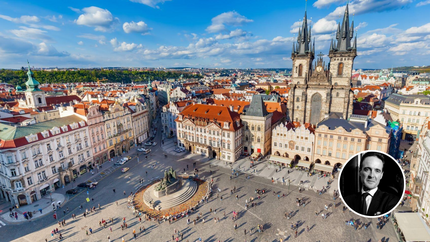 Aerial view of Prague showcasing its historic architecture and the Vltava River winding through the city.