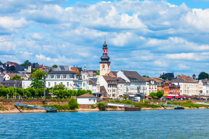 A clear blue sky dotted with fluffy white clouds, creating a serene and peaceful atmosphere.