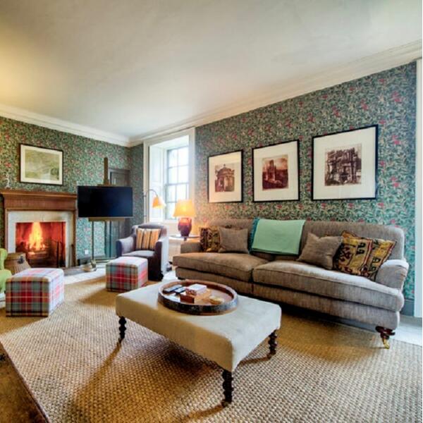 living room with cosy sofas and fire place