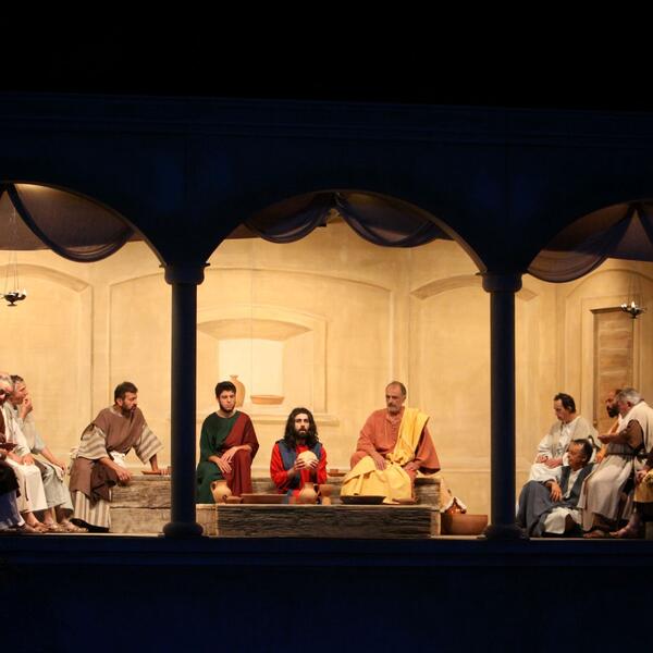 A scene from the Sordevolo Passion Play with actors seated in a room