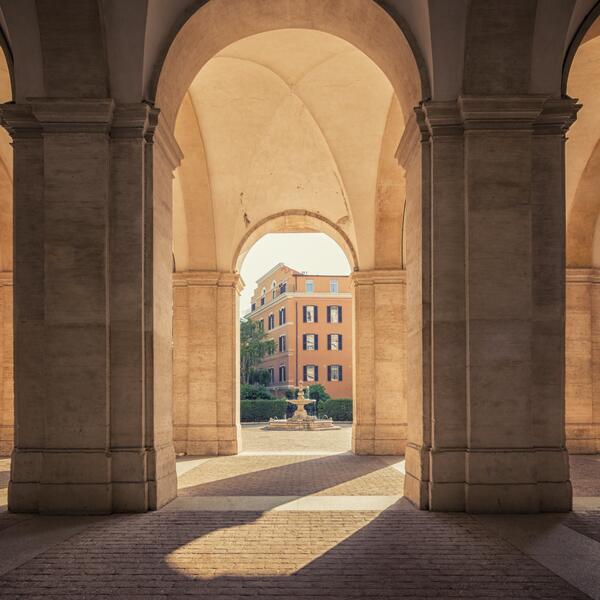A large archway featuring multiple arches and decorative pillars, showcasing architectural elegance and grandeur.