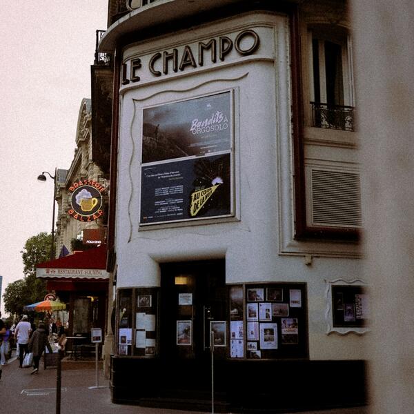 A cinema exterior featuring a prominent sign that reads "Le Champo."