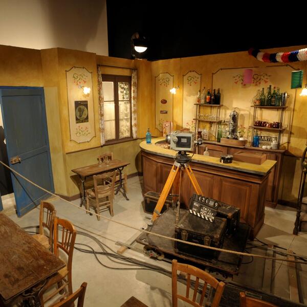 A film set featuring a bar, chairs, and tables